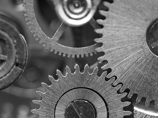 Black white background with metal cogwheels a clockwork. Conceptual photo for your successful business design. Macro